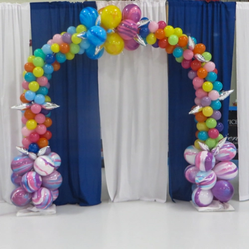 colourful balloon arch with many balloons