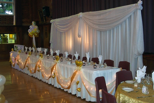 wedding head table with organza backdrop