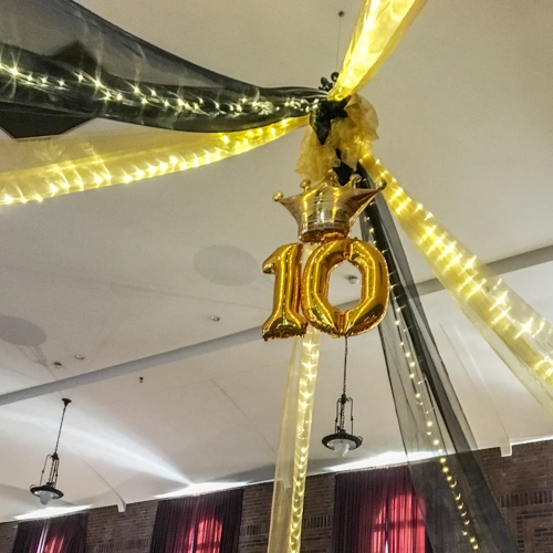 black and gold ceiling treatment with lights