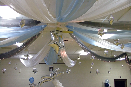 blue and white organza ceiling treatment with hanging silver stars