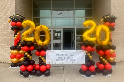 red, gold, and black columns for school graduation
