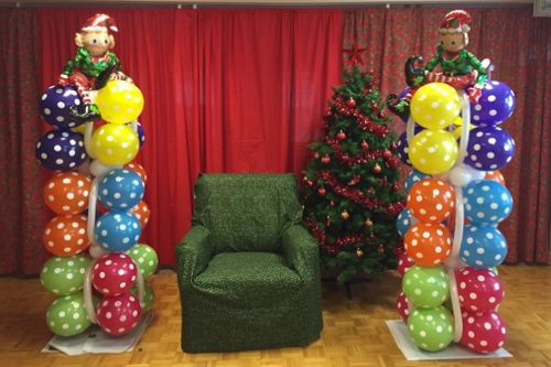 balloon columns beside Santa