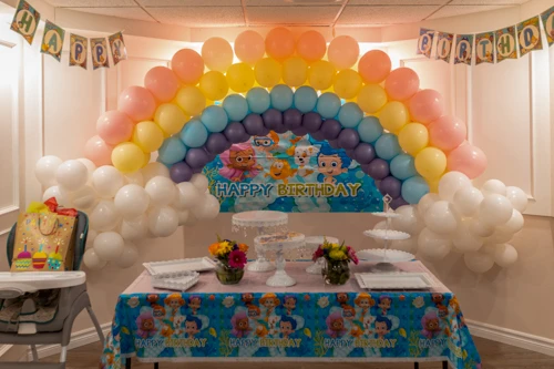 pastel rainbow balloon arch for child