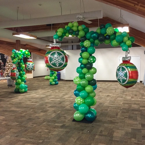 green balloon trees with foil ornaments for a Christmas party