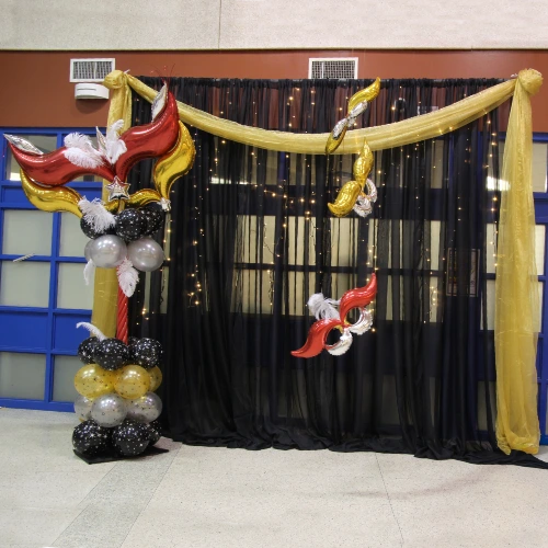 red, gold, black and silver prom decor