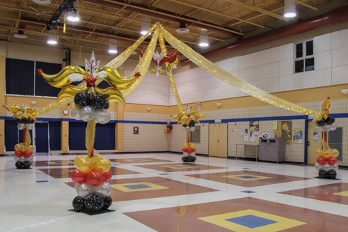 red, gold, silver, and black dance floor canopy