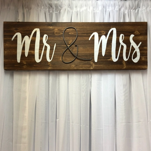 Mr. and Mrs. sign