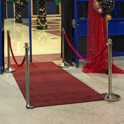stanchion posts and red carpet
