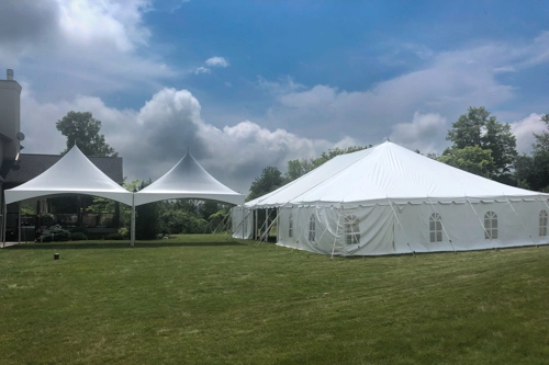 large white tent and 2 smaller tents