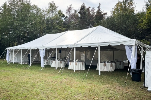 white tent with round tables