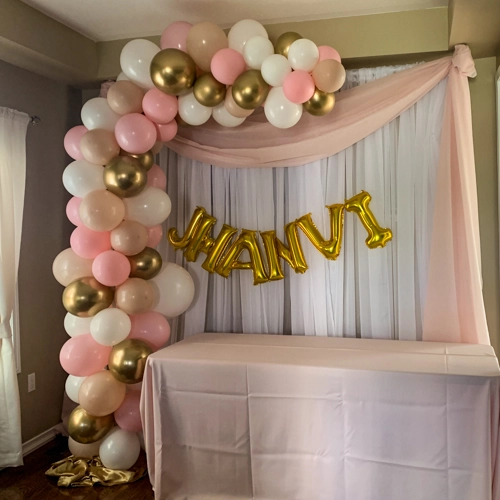 soft pink white and gold organic balloon arch